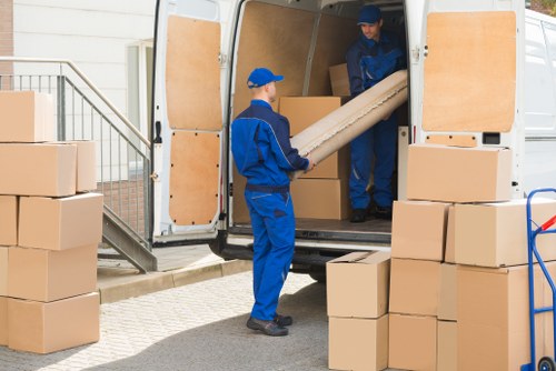 Professional packing team organizing household boxes in a Rotherhithe flat