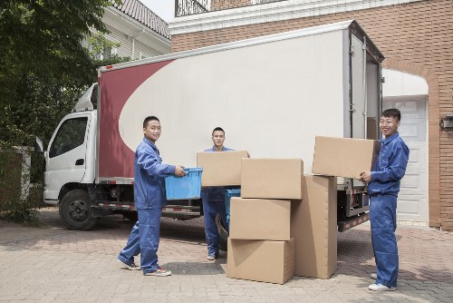 Removal van and moving boxes in a Rotherhithe street setting
