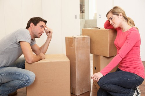 Removal team planning a move in a Rotherhithe residential street