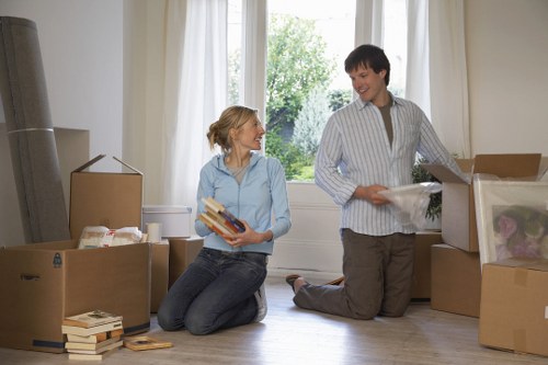 Removal team handling furniture in a modern apartment building
