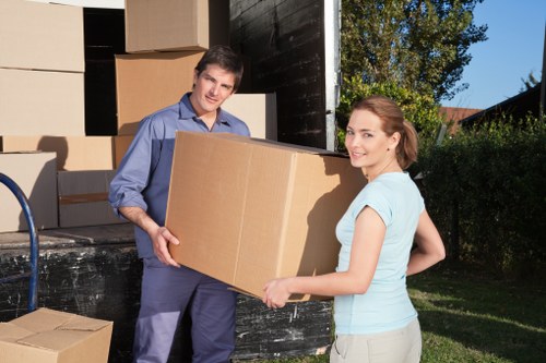 Office move preparation with labelled boxes and equipment